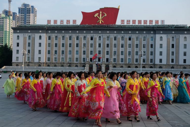 Dancers leave the square in Pyongyang after a mass dance